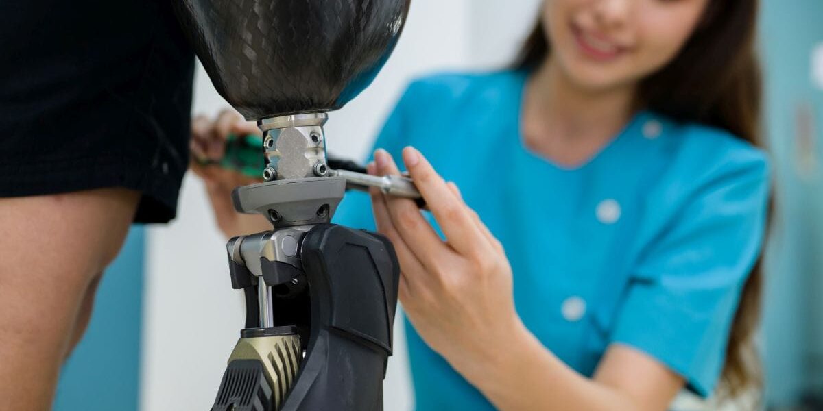 Female physiotherapist adjusting prosthetic leg of patient in hospital, Disables patient with treatment at health care center, New artificial limb production for disabled people